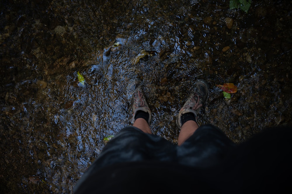 a person standing in a puddle of water