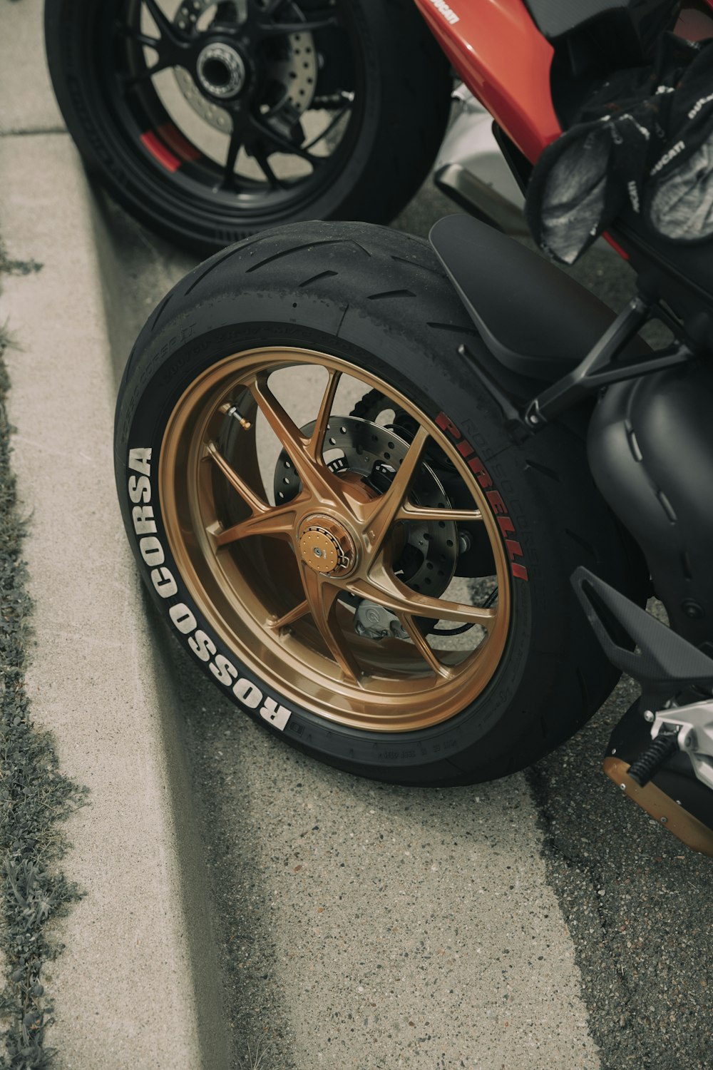 a close up of a motorcycle tire on the ground