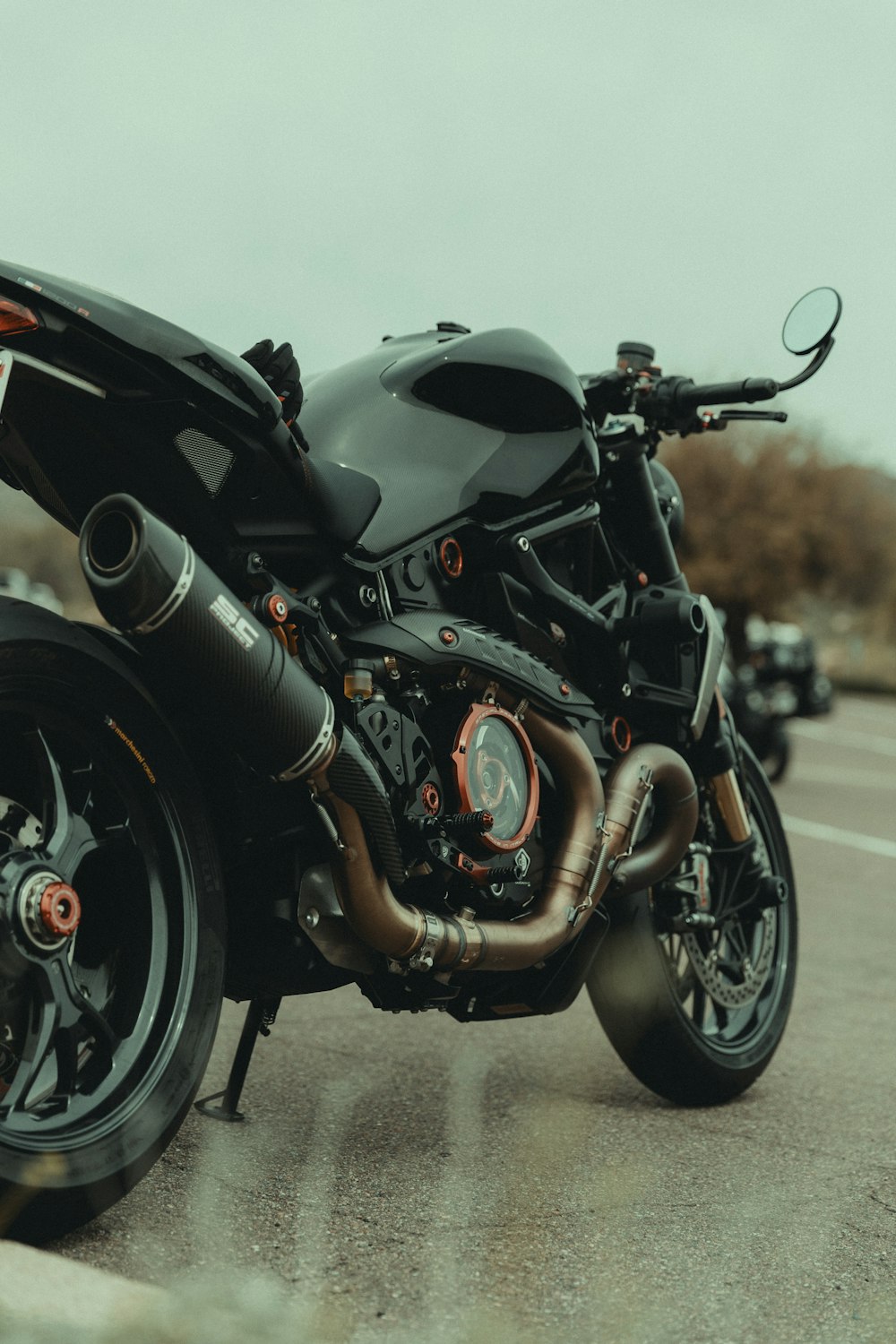 a black motorcycle parked on the side of the road