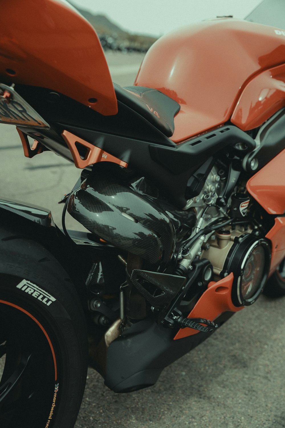 a close up of a motorcycle parked on the street