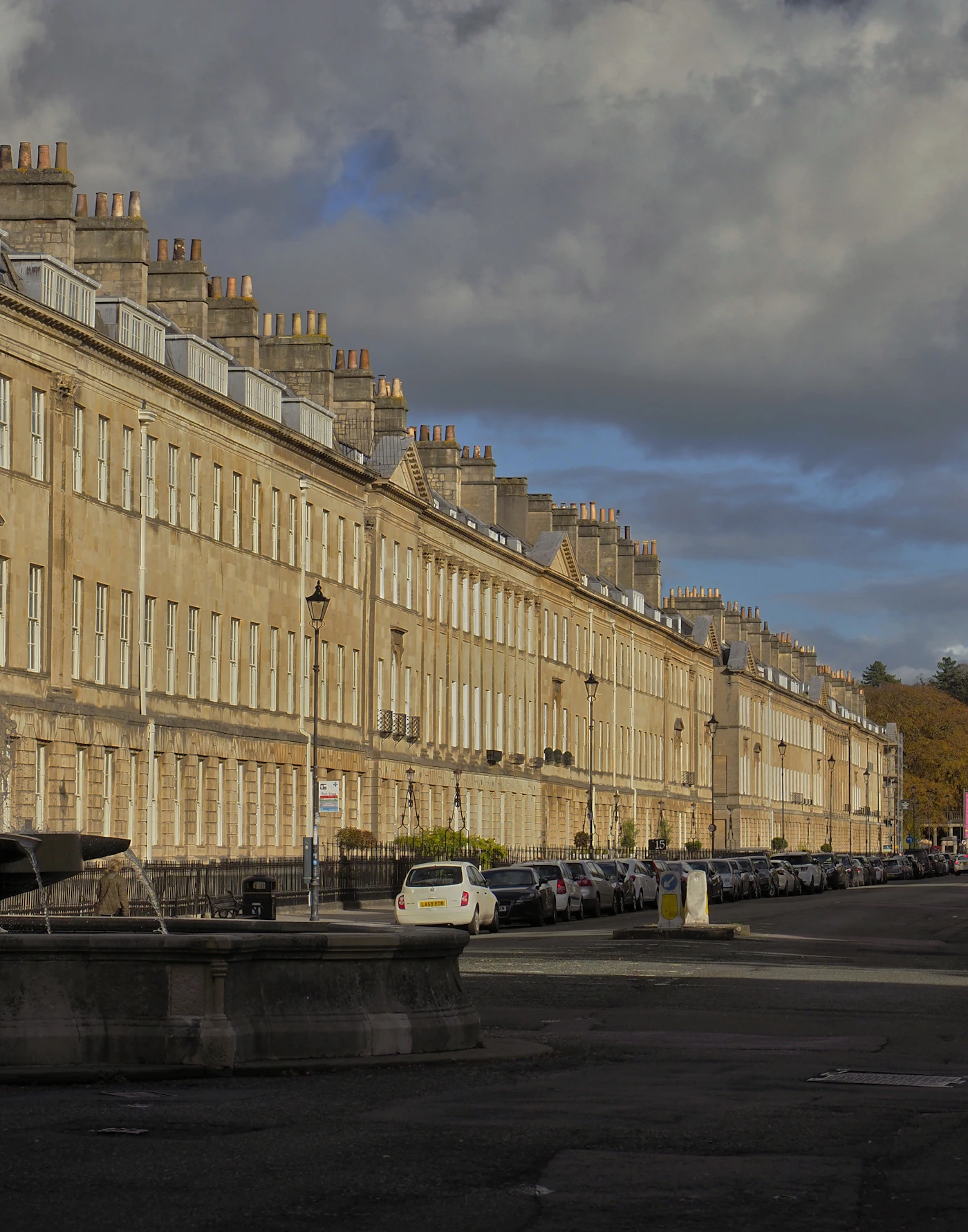 A road of stone terraces in Bath on an autumn day