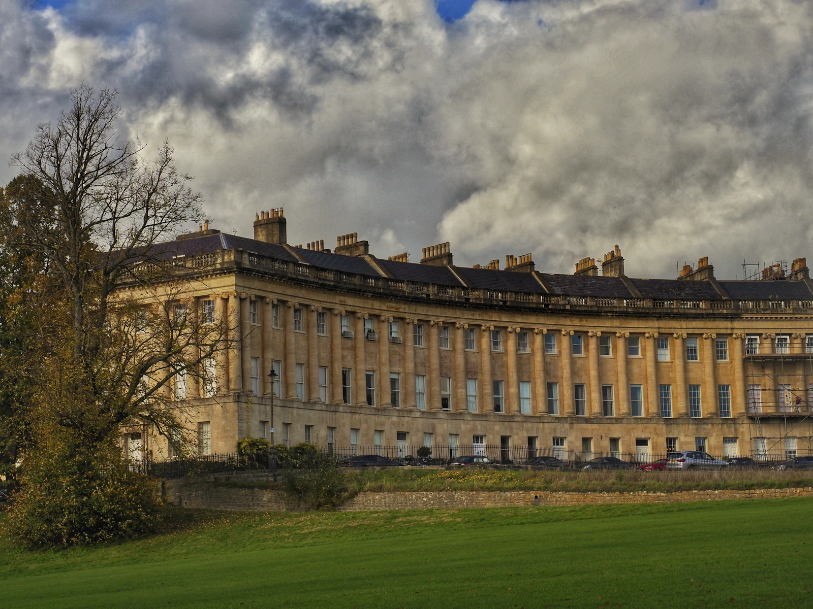 a large building sitting on top of a lush green field