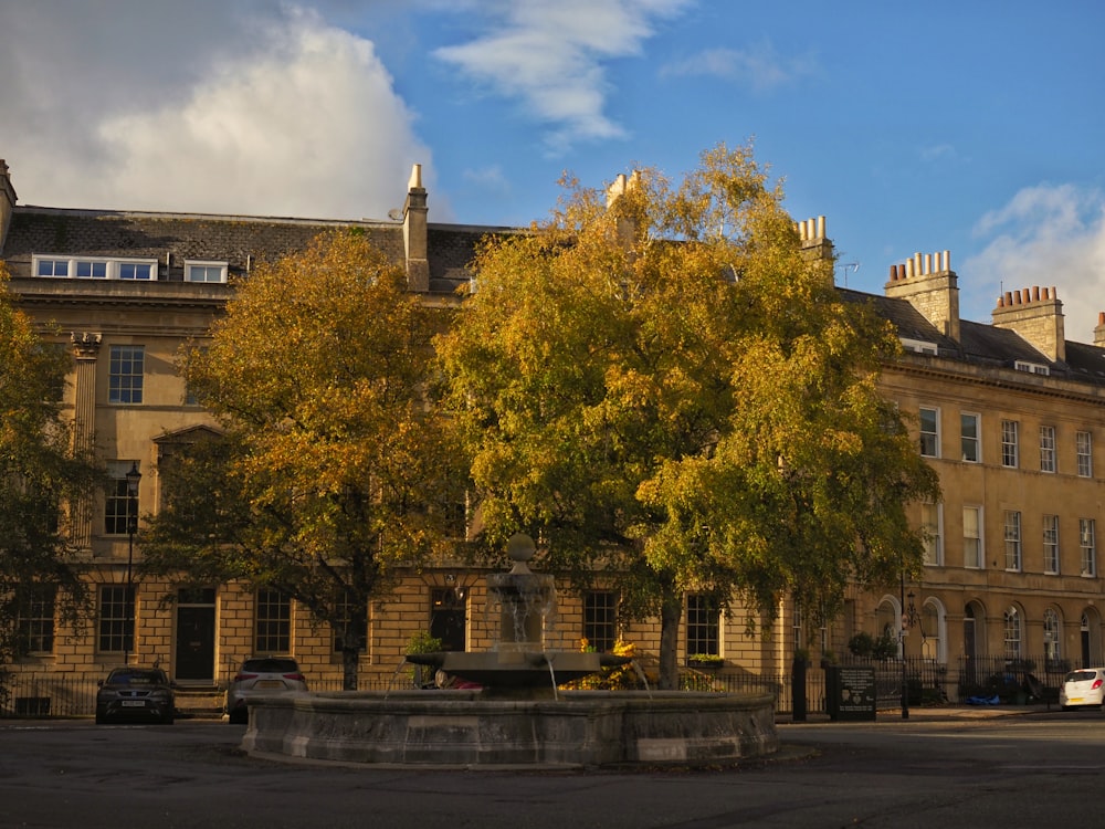 a large building with a fountain in front of it