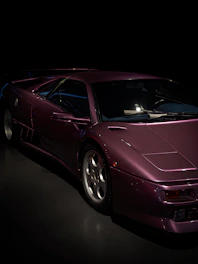 A sleek dark-themed website layout with purple accents on a horizontal slider.