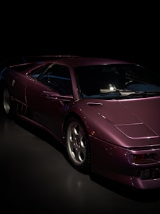 A sleek dark-themed website design with purple highlights on a black background.