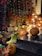 A beautifully decorated porch with colorful fall decorations and warm lighting.
