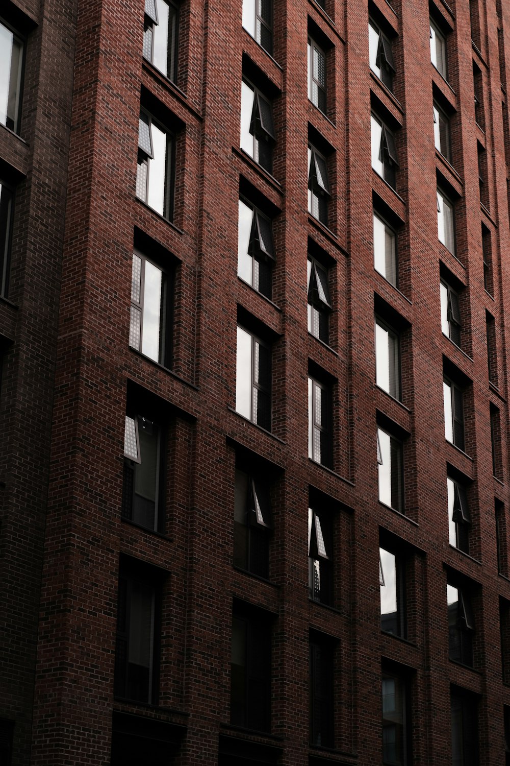 a tall brick building with lots of windows