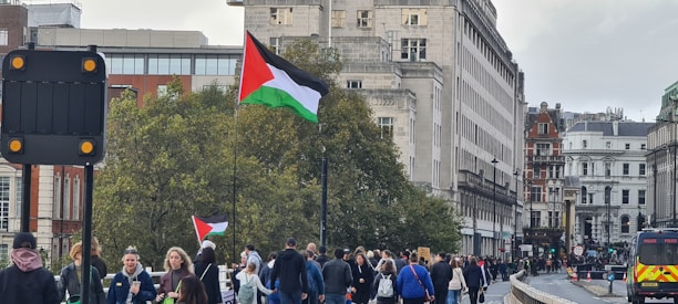 A vibrant street scene in Palestine showcasing women wearing stylish formal and casual outfits from Nai & Naz.