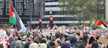 A crowd of protesters holding signs and flags during the March 24 revolution in Senegal.