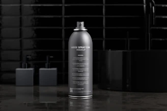 Close-up of sleek aerosol cans arranged neatly on a modern factory shelf under soft lighting.