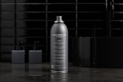 Close-up of a hand holding a Defenze Mintrix Spray canister with a blurred urban background.