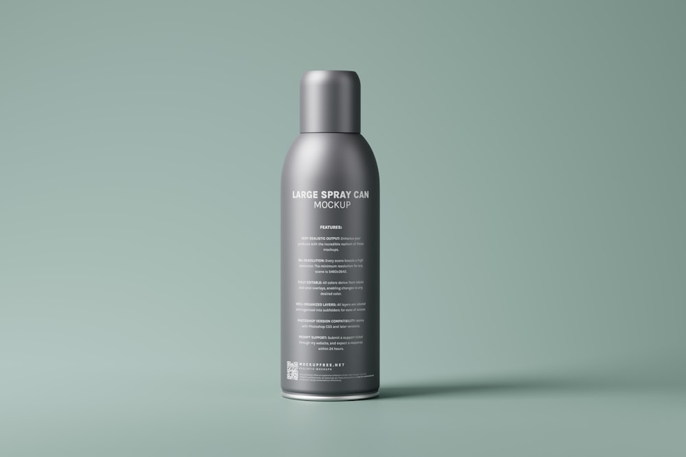 a bottle of hair product on a green background