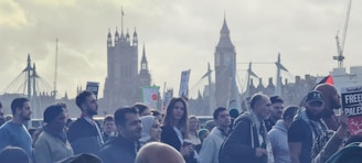 A vibrant community gathering with people holding banners.