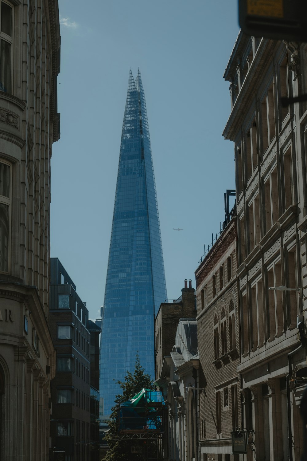 a very tall building towering over a city