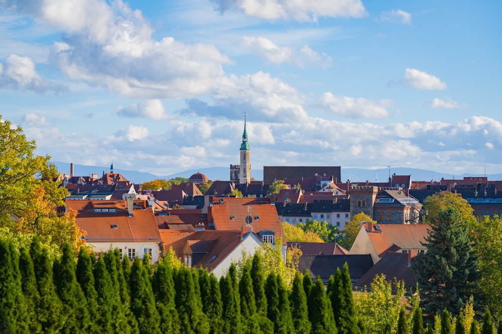 a view of a city with a clock tower in the background