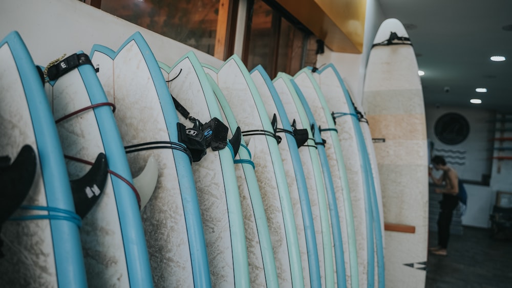 a row of surfboards sitting next to each other