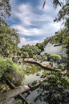 Indonesian travelers enjoying a serene Japanese garden.