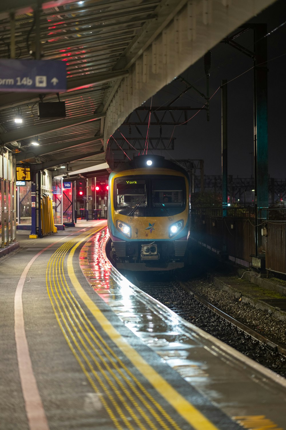 a train is coming down the tracks at night