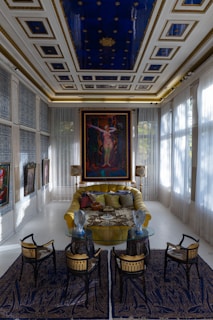 a living room with a couch a table and chairs