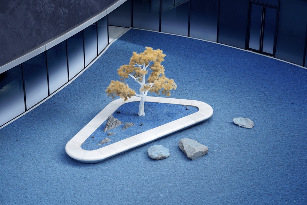 a model of a tree on a blue surface