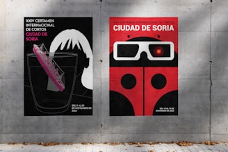 a couple of posters on the side of a building