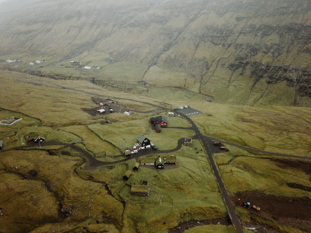 an aerial view of a small village in the mountains