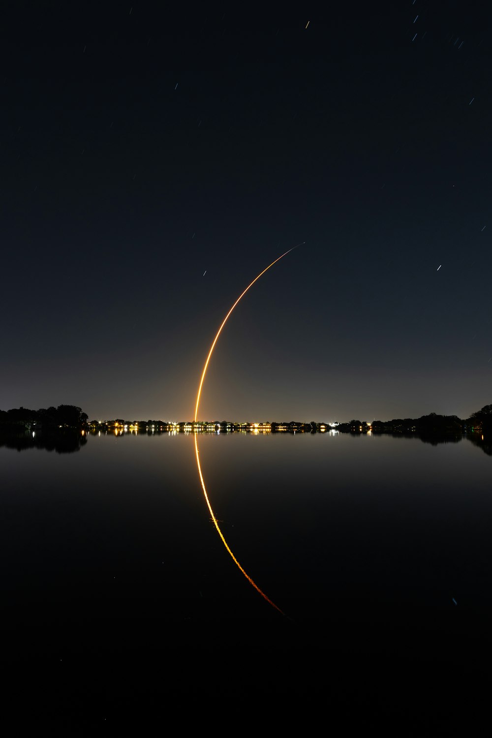 a long exposure photo of a rocket taking off