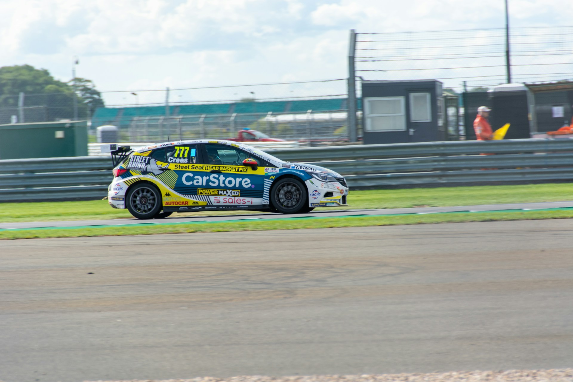 woman wearing yellow long-sleeved dress under white clouds and blue sky during daytime