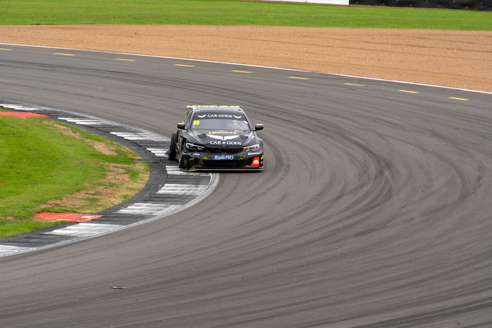 a car driving on a race track during the day
