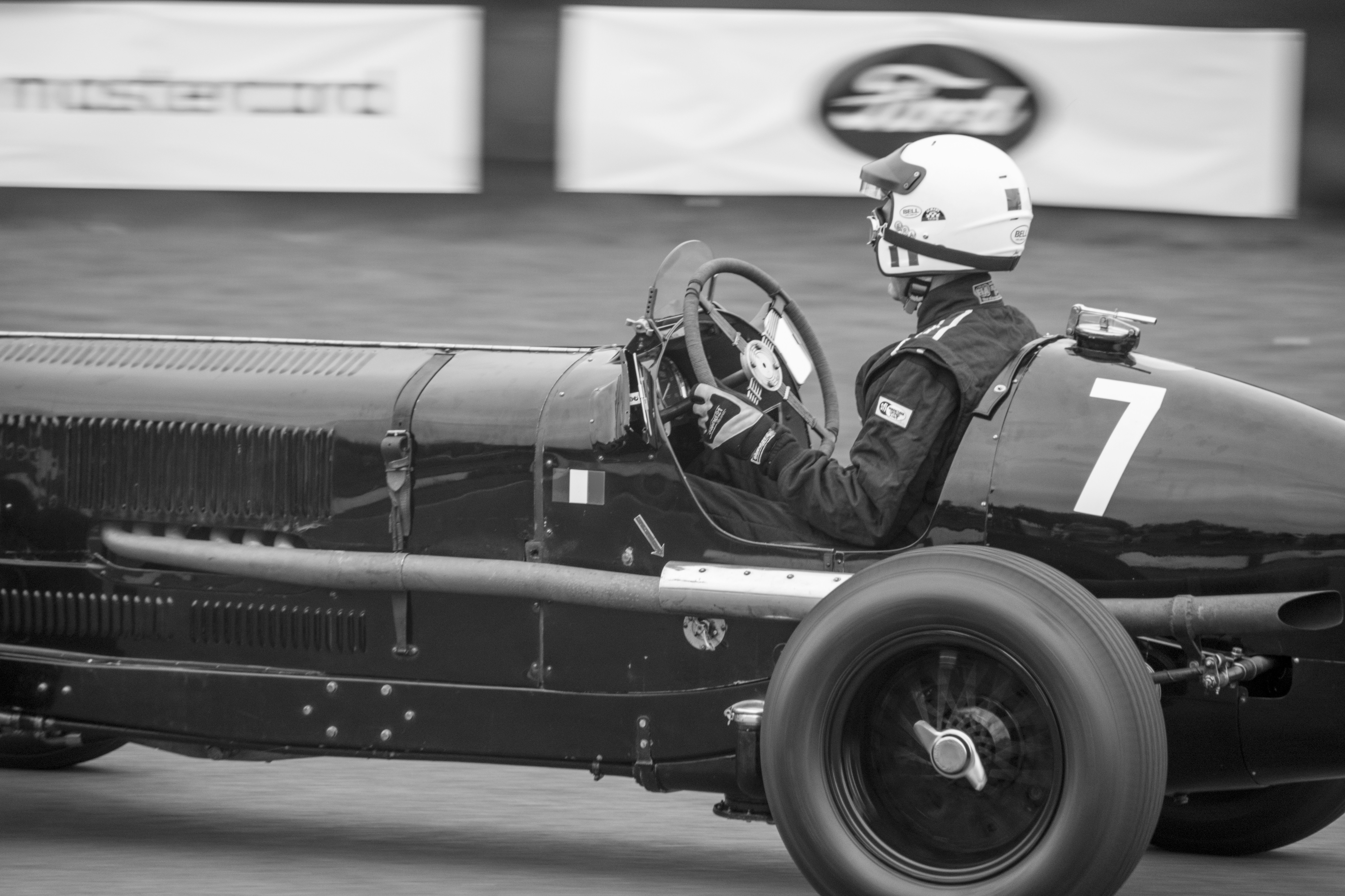 A man driving a race car on a track photo Free Goodwood motor circuit