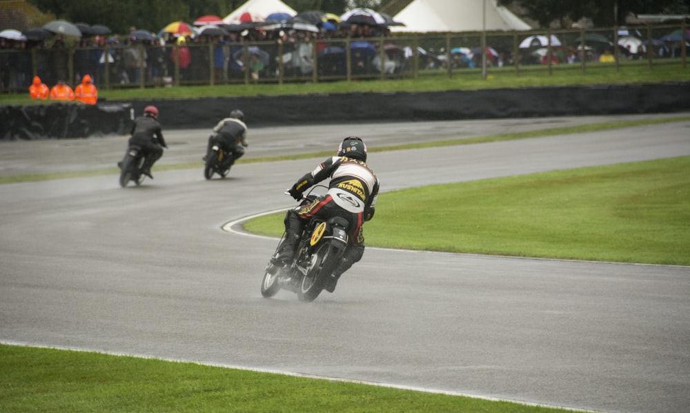a group of motorcyclists racing around a track