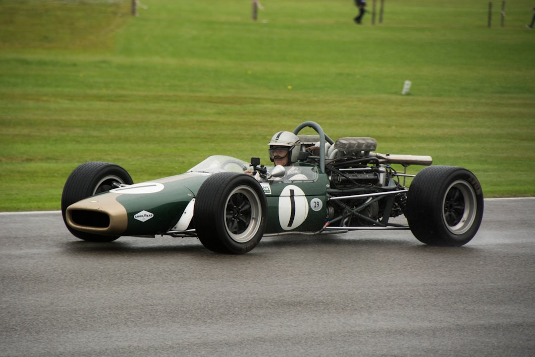 Classic Lotus Racing car racing on the track - Castle Combe Race Circuit, North Wiltshire, UK – Photo by Jaxon Smith | Castle Combe England