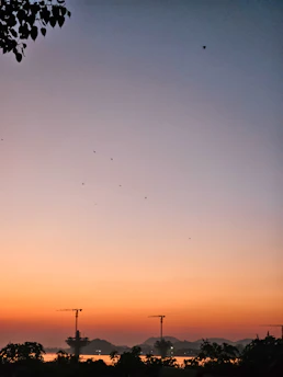 A serene Jaipur skyline at dawn with soft blue and green hues reflecting the calm and trust of Nishchay insurance advisory.