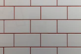 a close up of a white and red brick wall