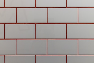 a close up of a white and red brick wall