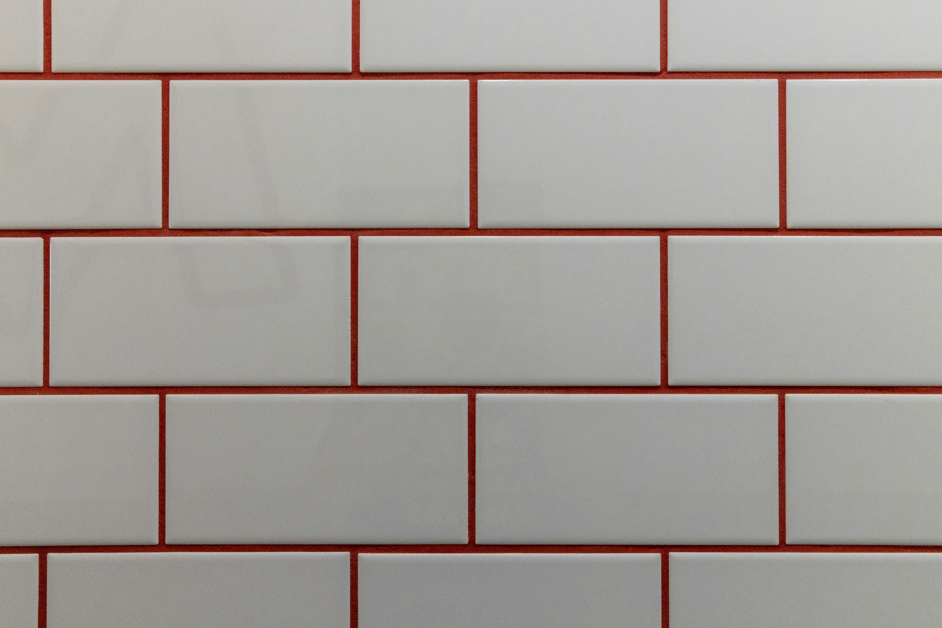 a close up of a white and red brick wall
