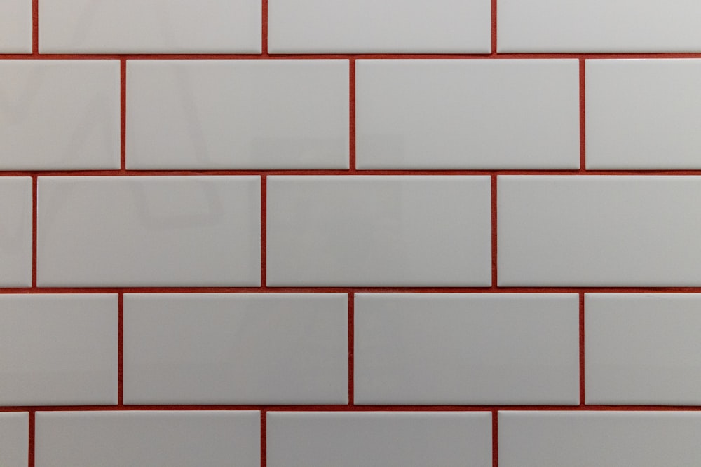 a close up of a white and red brick wall