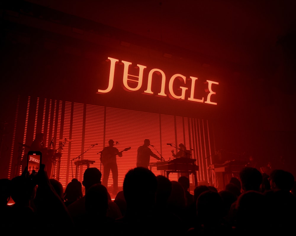 a group of people standing on top of a stage