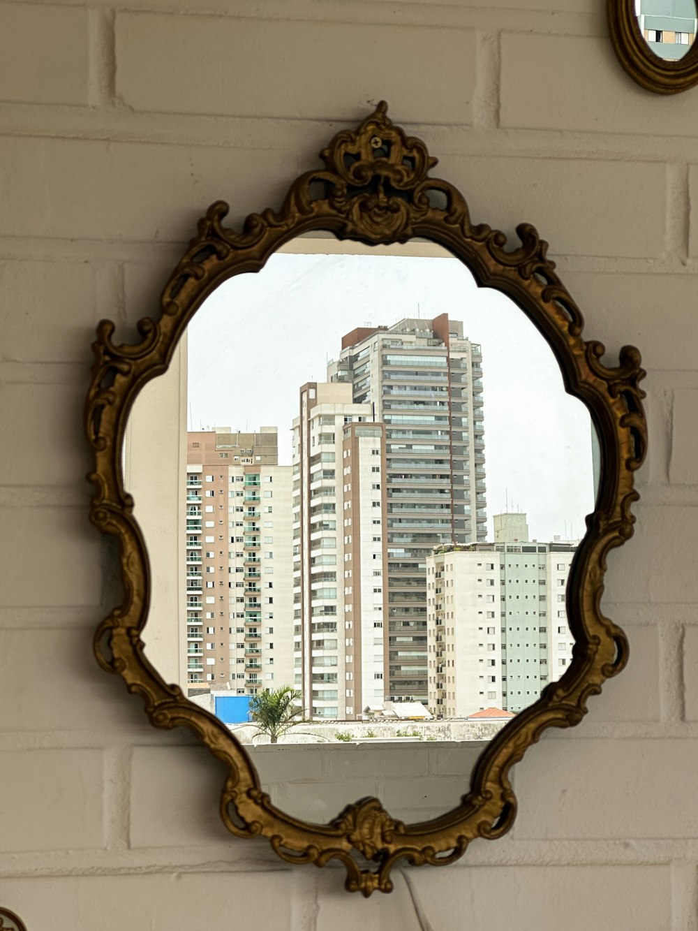 a mirror hanging on the wall of a building