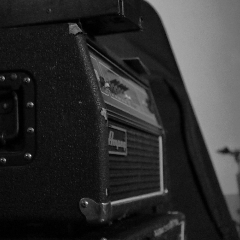 a black and white photo of a guitar amplifier