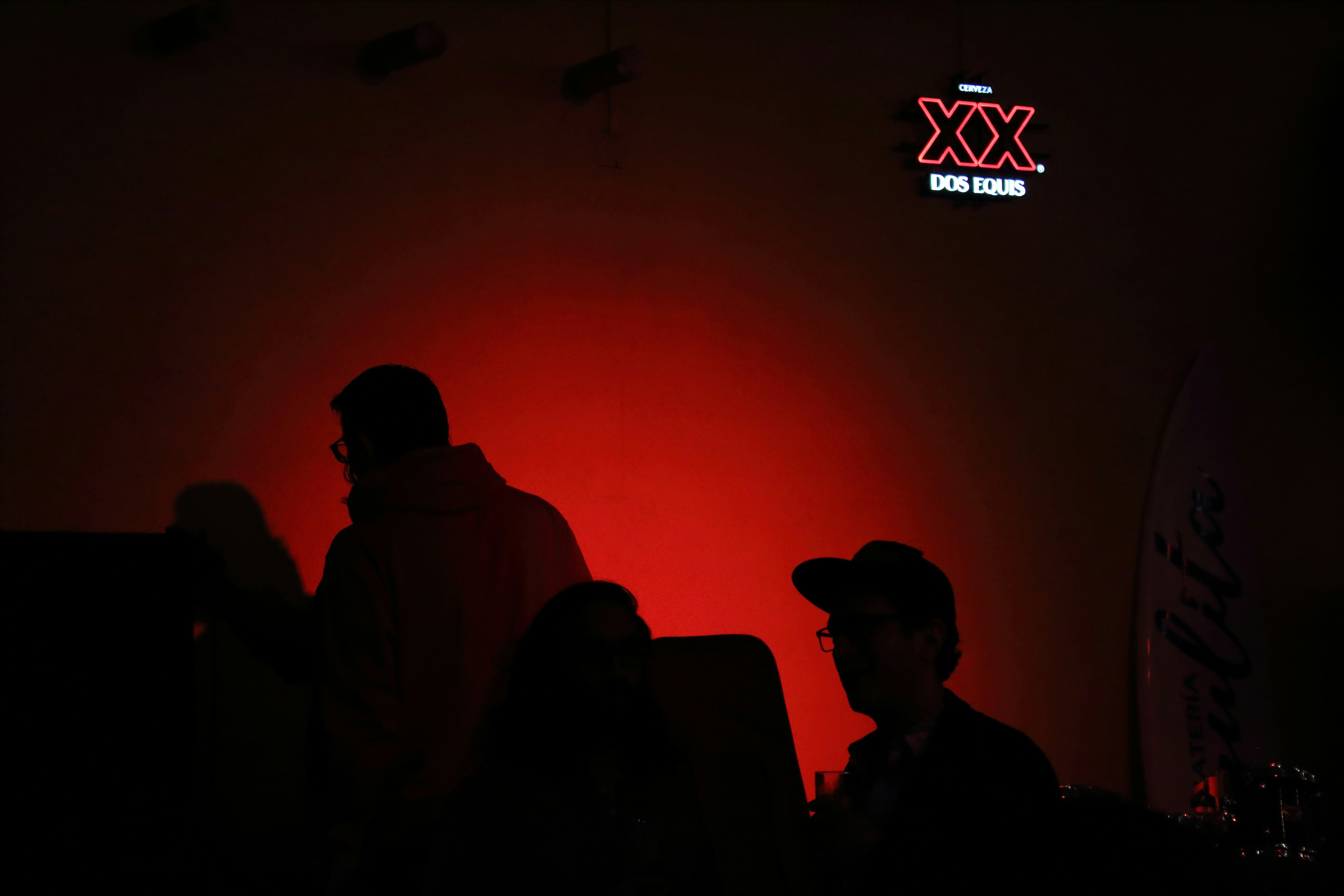 Black silhouettes on a red background