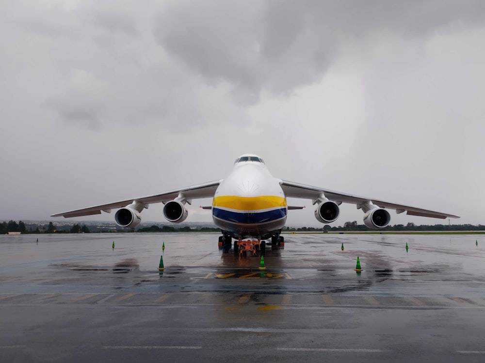 a large jetliner sitting on top of an airport tarmac