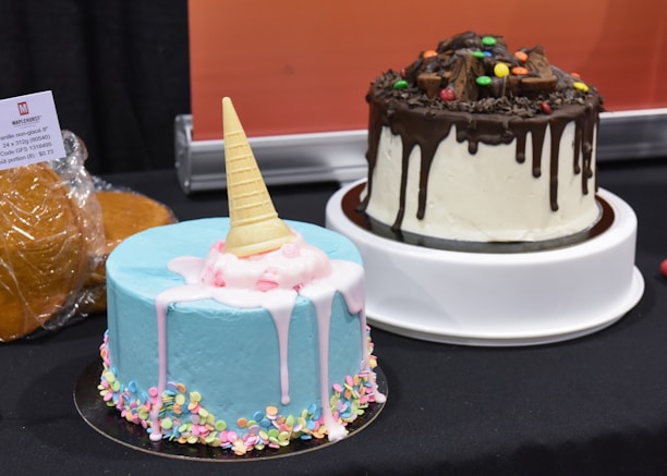 a couple of cakes sitting on top of a table