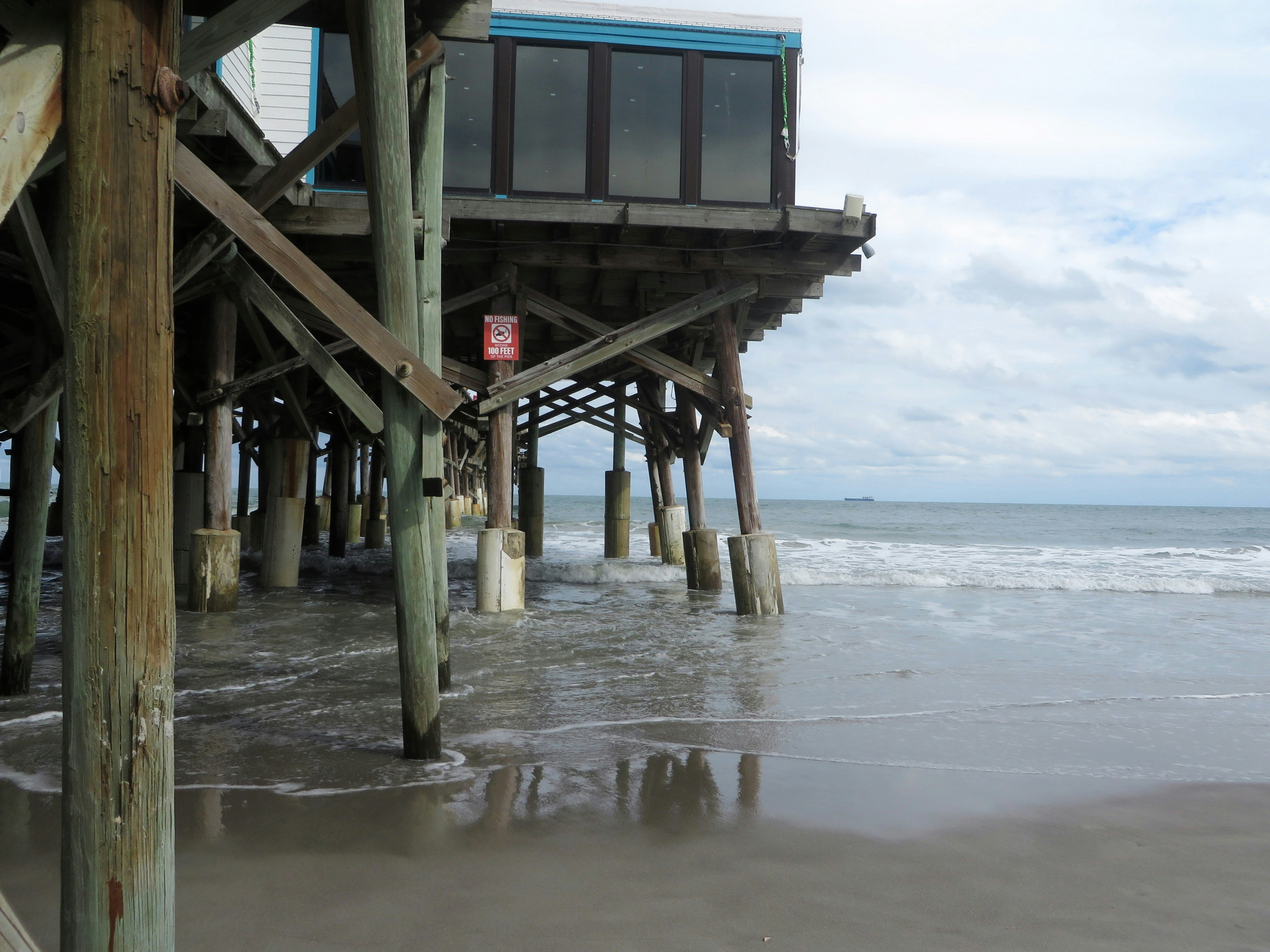 a view of a pier from the beach