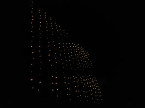 Dark-themed abstract tech background with subtle glowing lines forming a network pattern.