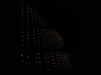 Dark background featuring a glowing grid pattern representing complex computing layers.