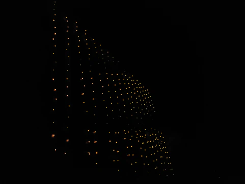 A glowing pixel grid styled like a dark retro GitHub heatmap with neon amber highlights.