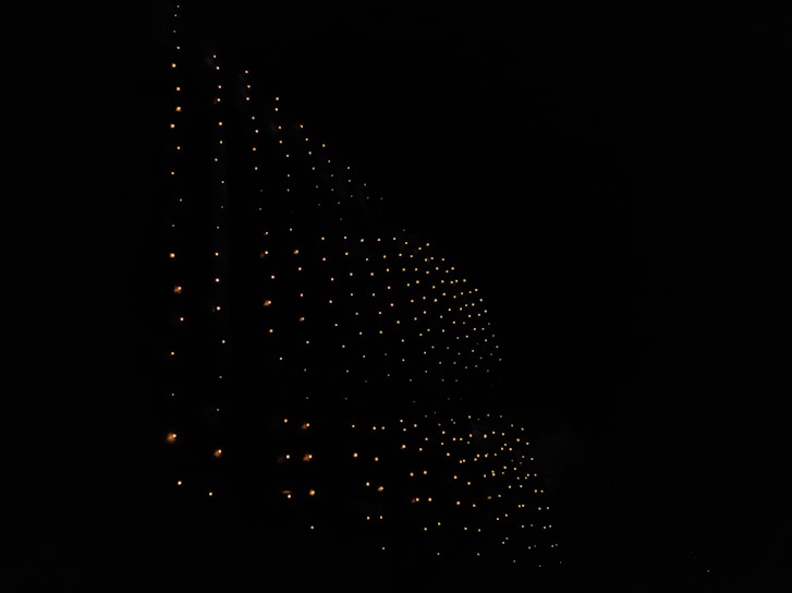 A sleek honeycomb pattern glowing with blue gradients against a dark space-like background.