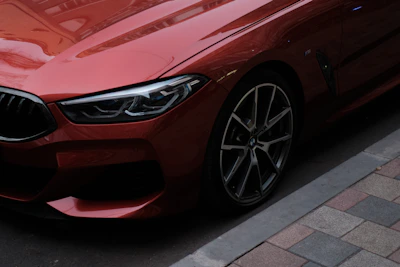 a red car parked on the side of the road