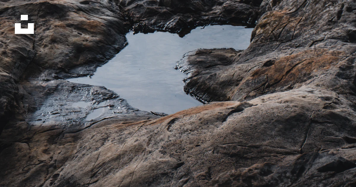 A small puddle of water in some rocks photo – Free Croatia Image on ...